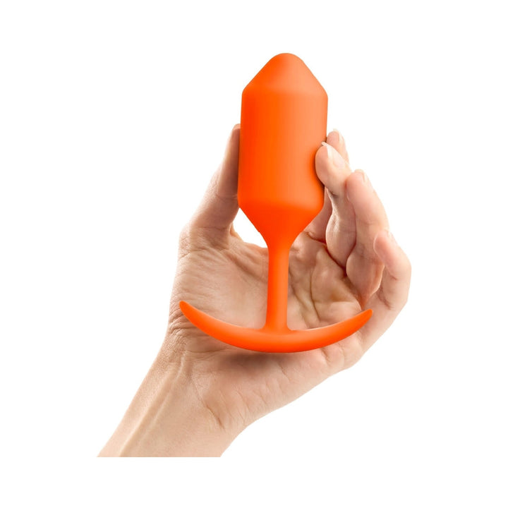 b-Vibe Snug Plug 3 Weighted Silicone Anal Plug Orange - Headshop.com